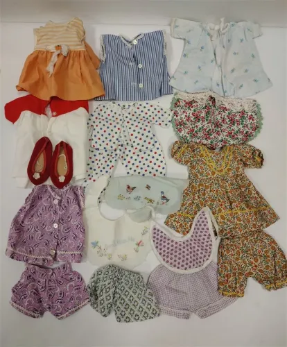 MEDIUM SIZE VINTAGE DOLL CLOTHES AND TWO OLD BIBS