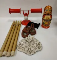 FOUR RONSON CANDLES, STRONG MAN TOILET PAPER HOLDER, RUSSIAN NESTED DOLL "STUCK", AS IS BEADED PURSE, LEATHER BABY MOCCASINS
