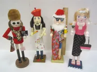 FOUR HOLIDAY CHEER WOODEN NUTCRACKERS