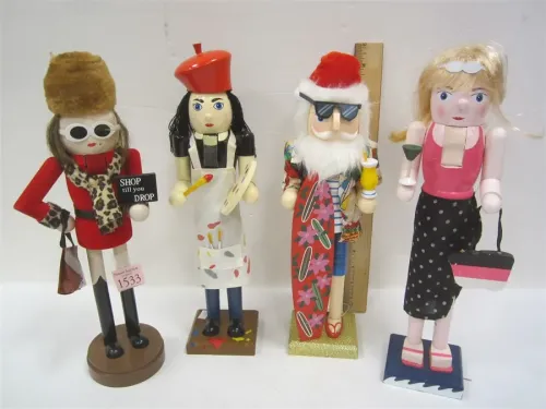 FOUR HOLIDAY CHEER WOODEN NUTCRACKERS